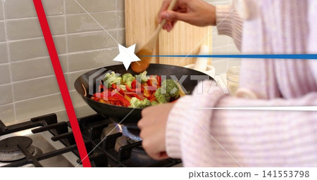 Stirring Indian woman in sweater cooking at stove with wok, wooden spoon, veg, blue flame, overlays Stirring Indian woman in sweater cooking at stove with wok, wooden spoon, veg, blue flame, overlays 141553798