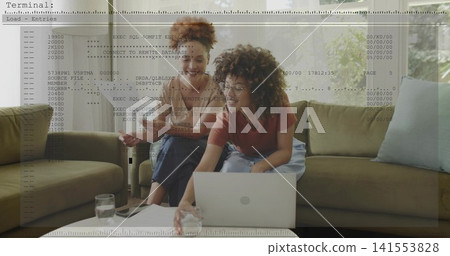 Leaning women checking code on silver laptop at home, wearing short sleeves, with terminal overlay Leaning women checking code on silver laptop at home, wearing short sleeves, with terminal overlay 141553828