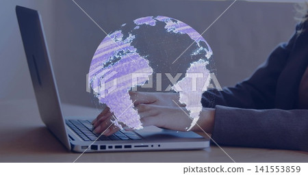 Typing worker in dark blazer using silver laptop with left ports at office desk, projecting globe Typing worker in dark blazer using silver laptop with left ports at office desk, projecting globe 141553859