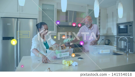 Helping two seniors and child sorting waste at kitchen island with PAPER, PLASTIC bins, AR icons Helping two seniors and child sorting waste at kitchen island with PAPER, PLASTIC bins, AR icons 141554018