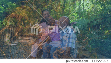 Sitting senior woman, child, senior man sharing moment on bench in wooded park, golden overlay Sitting senior woman, child, senior man sharing moment on bench in wooded park, golden overlay 141554023