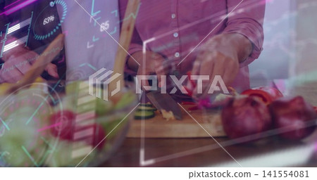 Chopping man wearing pink shirt using chef's knife at kitchen counter with holographic overlays Chopping man wearing pink shirt using chef's knife at kitchen counter with holographic overlays 141554081