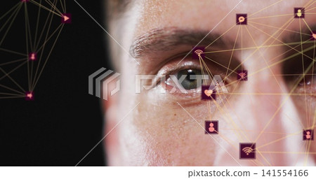 Highlighting mid adult male face focusing on right eye in studio, with digital network overlay Highlighting mid adult male face focusing on right eye in studio, with digital network overlay 141554166