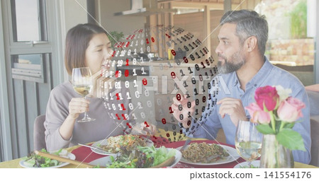 Sitting couple home table man blue-shirt gesturing woman gray-sweater holding wine binary globe Sitting couple home table man blue-shirt gesturing woman gray-sweater holding wine binary globe 141554176