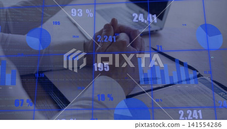 Analyzing two men in dress shirts reviewing financials in meeting room with laptop and blue overlay Analyzing two men in dress shirts reviewing financials in meeting room with laptop and blue overlay 141554286