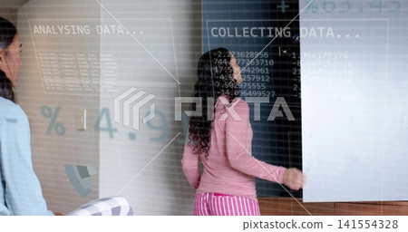 Reaching woman in pink top and striped pants opening white sliding panel in room projecting data Reaching woman in pink top and striped pants opening white sliding panel in room projecting data 141554328