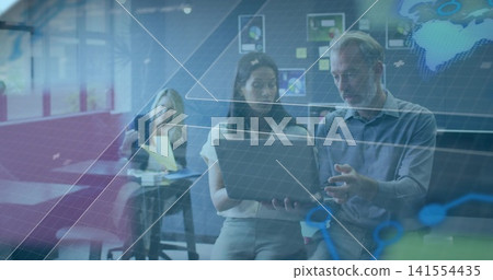 Working team in business clothes holding laptop and pointing at screen in open office, AR overlays Working team in business clothes holding laptop and pointing at screen in open office, AR overlays 141554435