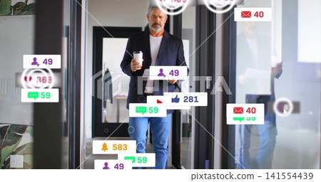 Walking man wearing blazer, jeans, holding cup and tablet through glass corridor with notifications Walking man wearing blazer, jeans, holding cup and tablet through glass corridor with notifications 141554439