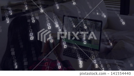 Reclining plaid-shirt woman holding cup, phone on bed, rumpled sheets, laptop, binary, copy space Reclining plaid-shirt woman holding cup, phone on bed, rumpled sheets, laptop, binary, copy space 141554440