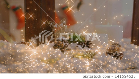 Displaying vignette on mantel near window, showing frosted pinecones and wired star ornament Displaying vignette on mantel near window, showing frosted pinecones and wired star ornament 141554523