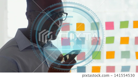Speaking man in collared shirt holding smartphone at office glass with post-its and lock graphic 141554530