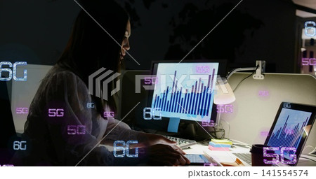 Working woman wearing light blouse analyzing charts on monitor at office desk, with 5G 6G overlays Working woman wearing light blouse analyzing charts on monitor at office desk, with 5G 6G overlays 141554574