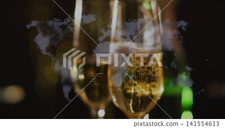 Clinking two champagne flutes showing rising bubbles, glare in bar, dotted world map, green bottle 141554613