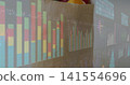 Projecting multi-panel data visuals wall showing analytics in meeting room, with stacked bar charts 141554696