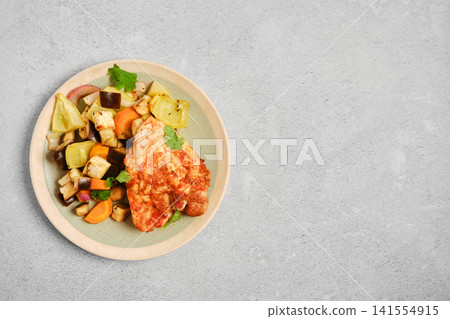 Grilled chicken with vegetables served on a plate Grilled chicken with vegetables served on a plate 141554915
