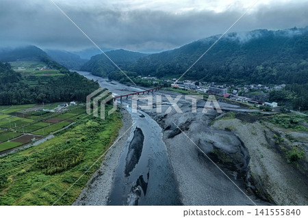 Aerial photograph of a mountainous area overlooking the Oi River and a red bridge in Shimada City, Shizuoka Prefecture. Aerial photograph of a mountainous area overlooking the Oi River and a red bridge in Shimada City, Shizuoka Prefecture. 141555840