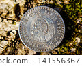 Souvenir coin of five pesos in the style of Hobo Nickel with the image of a skull in place of the portrait of the Aztec ruler Cuauhtemoc 141556367