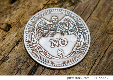 Souvenir coin for making a decision with the word No dropped 141556370