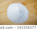 Aluminum oxide or electrocorundum - a pile of white abrasive powder with a grain size of 250 micrometers, formula Al2O3 141556377