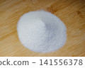 Aluminum oxide or electrocorundum - a pile of white abrasive powder with a grain size of 250 micrometers, formula Al2O3 141556378