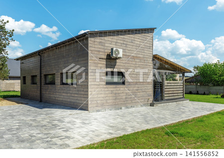 Modern Wooden Country House Exterior with Paved Area Modern Wooden Country House Exterior with Paved Area 141556852