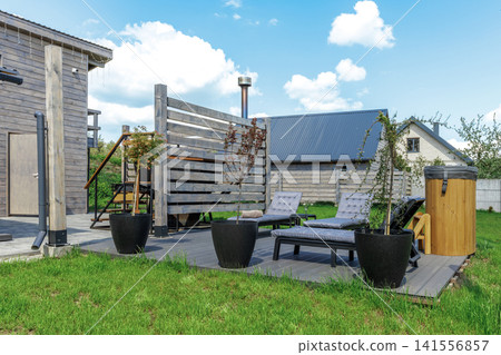 Backyard Patio Deck with Lounge Chairs and Hot Tubs Backyard Patio Deck with Lounge Chairs and Hot Tubs 141556857