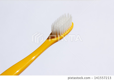It is a colorful toothbrush. It is a colorful toothbrush. 141557213