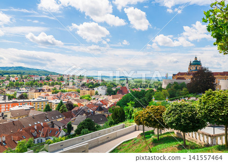 Panoramic view of Melk Abbey overlooking the historic town of Melk in Austria Panoramic view of Melk Abbey overlooking the historic town of Melk in Austria 141557464