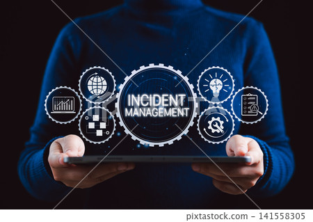 Incident Management System Technology Concept. A person holding tablet with interface Incident Management, icons symbolizing analytics, strategy, process, risk assessment, and problem resolution. Incident Management System Technology Concept. A person holding tablet with interface Incident Management, icons symbolizing analytics, strategy, process, risk assessment, and problem resolution. 141558305