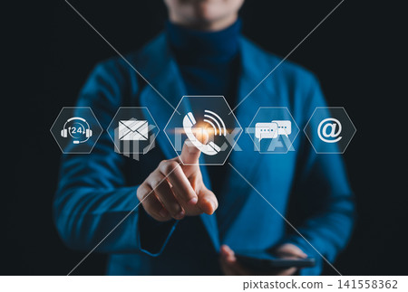 Customer Support and Communication Channel Concept. Businessperson interacting with icons for communication channels including phone, email, chat, and support, representing customer service access. Customer Support and Communication Channel Concept. Businessperson interacting with icons for communication channels including phone, email, chat, and support, representing customer service access. 141558362