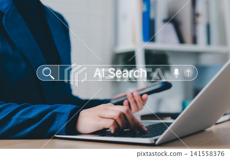 AI Search Engine Technology Concept. Woman use smartphone and laptop with AI search bar interface representing artificial intelligence search technology, voice input, innovation in modern information, AI Search Engine Technology Concept. Woman use smartphone and laptop with AI search bar interface representing artificial intelligence search technology, voice input, innovation in modern information, 141558376