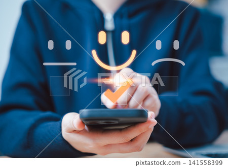 Customer review satisfaction feedback survey concept. A person interacts with virtual icons representing customer satisfaction levels, including happy, neutral, and sad faces, and feedback. rating, 141558399
