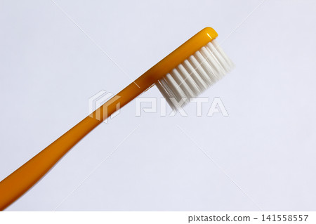 It is a colorful toothbrush. It is a colorful toothbrush. 141558557