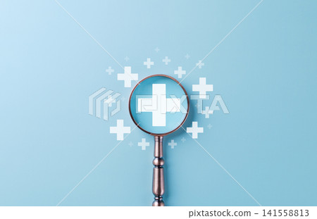Plus Sign Symbol. Magnifying glass focusing on white plus sign with small plus symbols, symbolizing benefits, positivity, added value, wellness services, improvement, insurance, medical, and health. Plus Sign Symbol. Magnifying glass focusing on white plus sign with small plus symbols, symbolizing benefits, positivity, added value, wellness services, improvement, insurance, medical, and health. 141558813