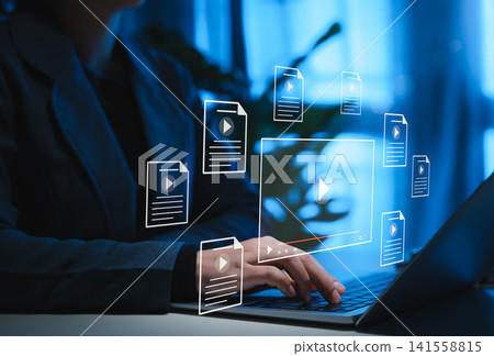 Online Video Content Management and Streaming Concept. Woman using laptop with digital icons of documents and video files, online video content management, streaming, and multimedia file organization. Online Video Content Management and Streaming Concept. Woman using laptop with digital icons of documents and video files, online video content management, streaming, and multimedia file organization. 141558815