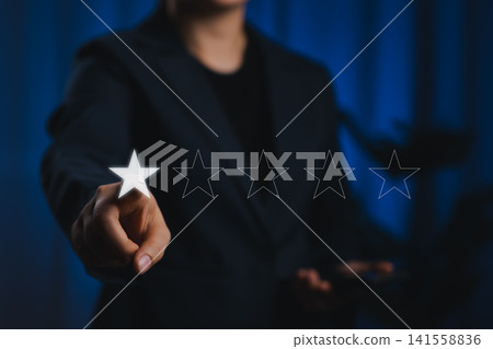 Negative Customer Review One Star Rating Concept. Woman pointing to single star out of five in digital rating system, representing negative customer feedback, dissatisfaction, poor service evaluation. Negative Customer Review One Star Rating Concept. Woman pointing to single star out of five in digital rating system, representing negative customer feedback, dissatisfaction, poor service evaluation. 141558836
