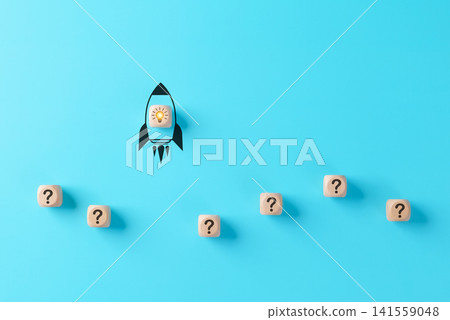 Startup Innovation and Business Growth Concept. Wooden block with light bulb, rocket icon taking off from row of question mark, represents new idea, startup success, problem solving, creative solution Startup Innovation and Business Growth Concept. Wooden block with light bulb, rocket icon taking off from row of question mark, represents new idea, startup success, problem solving, creative solution 141559048