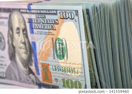 Stack of American 100-dollar bills Stack of American 100-dollar bills 141559460