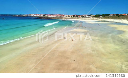 Experience the Stunning Aerial View of a Serene Beach with Beautiful, Crystal Clear Water Experience the Stunning Aerial View of a Serene Beach with Beautiful, Crystal Clear Water 141559680