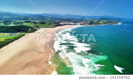 Experience a stunning aerial view of a serene beach and lush greenery that captivates Experience a stunning aerial view of a serene beach and lush greenery that captivates 141559702