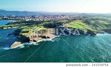 Experience breathtaking coastal views with lush greenery and vibrant blue waters of nature Experience breathtaking coastal views with lush greenery and vibrant blue waters of nature 141559754