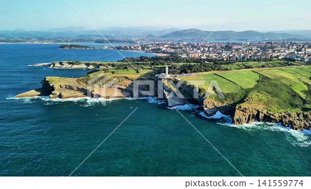 Stunning Scenic Aerial View of Breathtaking Coastal Cliffs and a Historic Lighthouse Stunning Scenic Aerial View of Breathtaking Coastal Cliffs and a Historic Lighthouse 141559774
