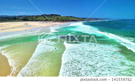 A Beautifully Vibrant Beach Scene with Crystal Clear Turquoise Waters and Sandy Coastline A Beautifully Vibrant Beach Scene with Crystal Clear Turquoise Waters and Sandy Coastline 141559782