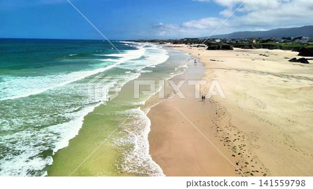 Experience a Breathtaking Aerial View of a Serene and Picturesque Coastal Beach Landscape Experience a Breathtaking Aerial View of a Serene and Picturesque Coastal Beach Landscape 141559798