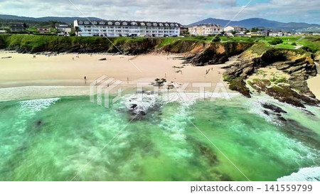 Enjoy a breathtaking scenic beach view featuring gentle waves, beautiful coastal cliffs, and more Enjoy a breathtaking scenic beach view featuring gentle waves, beautiful coastal cliffs, and more 141559799