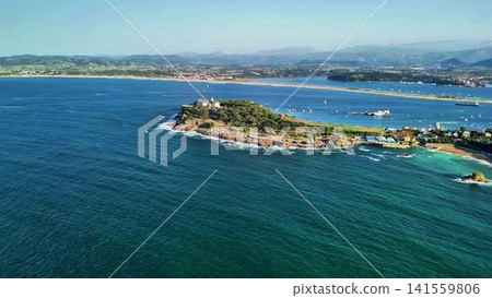 Stunning Aerial View Capturing the Beauty of a Scenic Coastal Island Rich with Lush Greenery Stunning Aerial View Capturing the Beauty of a Scenic Coastal Island Rich with Lush Greenery 141559806