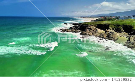 A Breathtaking Coastal View Featuring Stunning Turquoise Waters and Dramatic Cliffs A Breathtaking Coastal View Featuring Stunning Turquoise Waters and Dramatic Cliffs 141559822