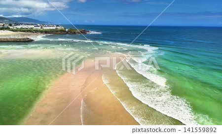 Experience a Stunning Aerial View of a Truly Peaceful Beach and the Clear Waters Beyond Experience a Stunning Aerial View of a Truly Peaceful Beach and the Clear Waters Beyond 141559892