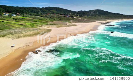 Experience a Stunning Aerial View of a Beautiful Sandy Beach with Turquoise Waves Experience a Stunning Aerial View of a Beautiful Sandy Beach with Turquoise Waves 141559900