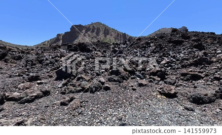 Explore the stunning beauty of a volcanic landscape with captivating rocky terrain Explore the stunning beauty of a volcanic landscape with captivating rocky terrain 141559973